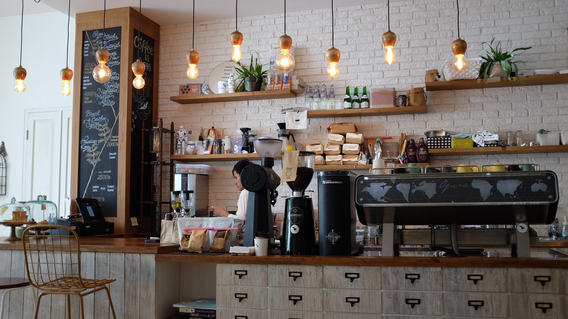 A cup of coffee on a saucer at The Roasted Bean coffee shop